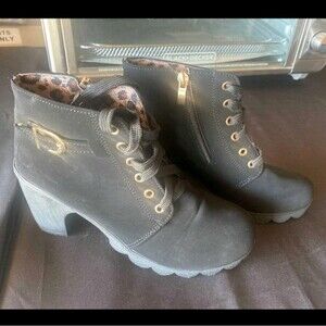 Stylish Black Lace-Up Boots with Gold Details